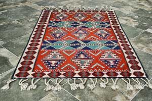 A large and red patterned area rug